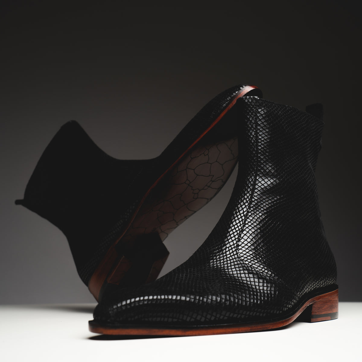 Black printed python boots