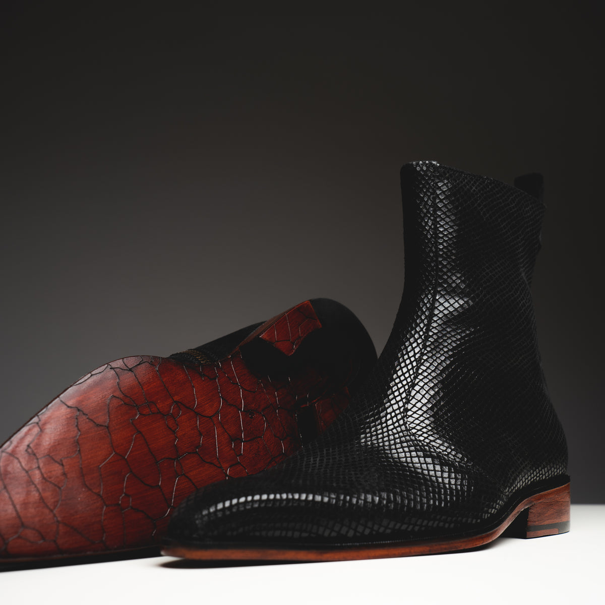 Black printed python boots