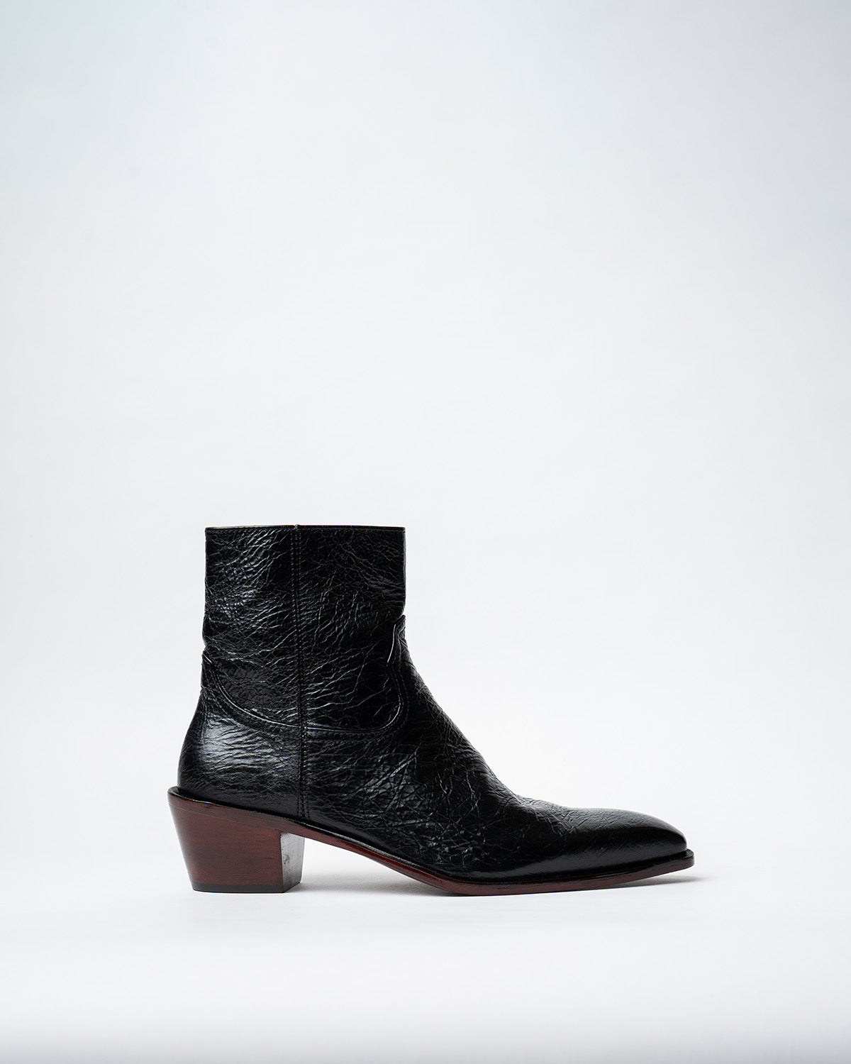 ANKLE BOOTS WITH A SQUARE POINTED TOE AND TRAPEZOID HEEL, FEATURING A SIDE ZIP CLOSURE