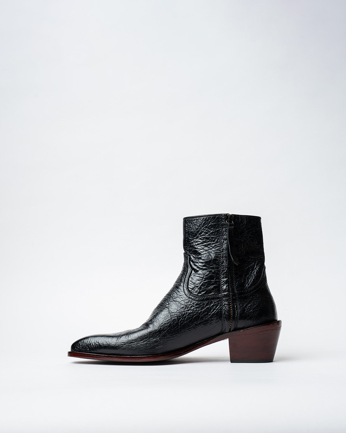 ANKLE BOOTS WITH A SQUARE POINTED TOE AND TRAPEZOID HEEL, FEATURING A SIDE ZIP CLOSURE