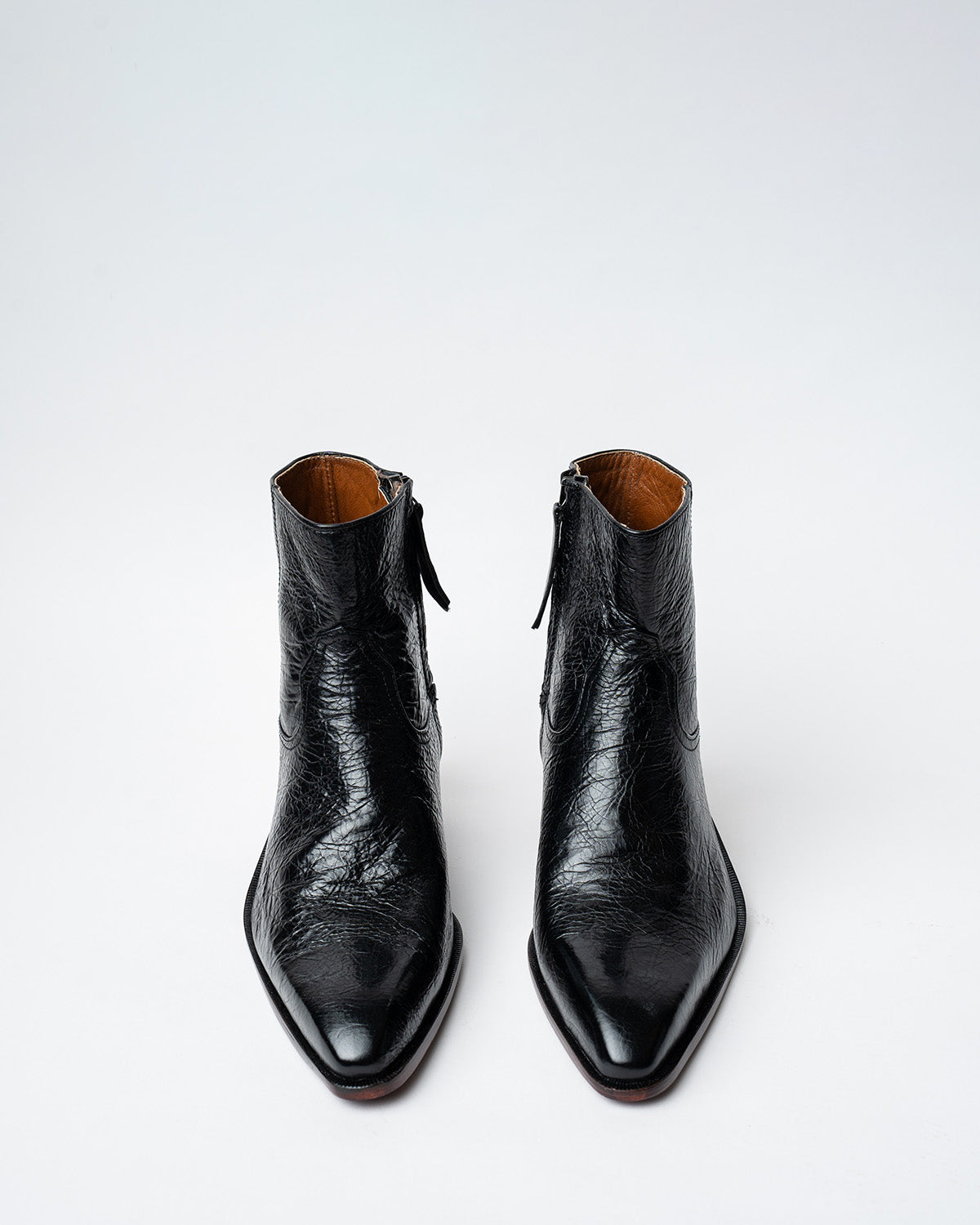 ANKLE BOOTS WITH A SQUARE POINTED TOE AND TRAPEZOID HEEL, FEATURING A SIDE ZIP CLOSURE