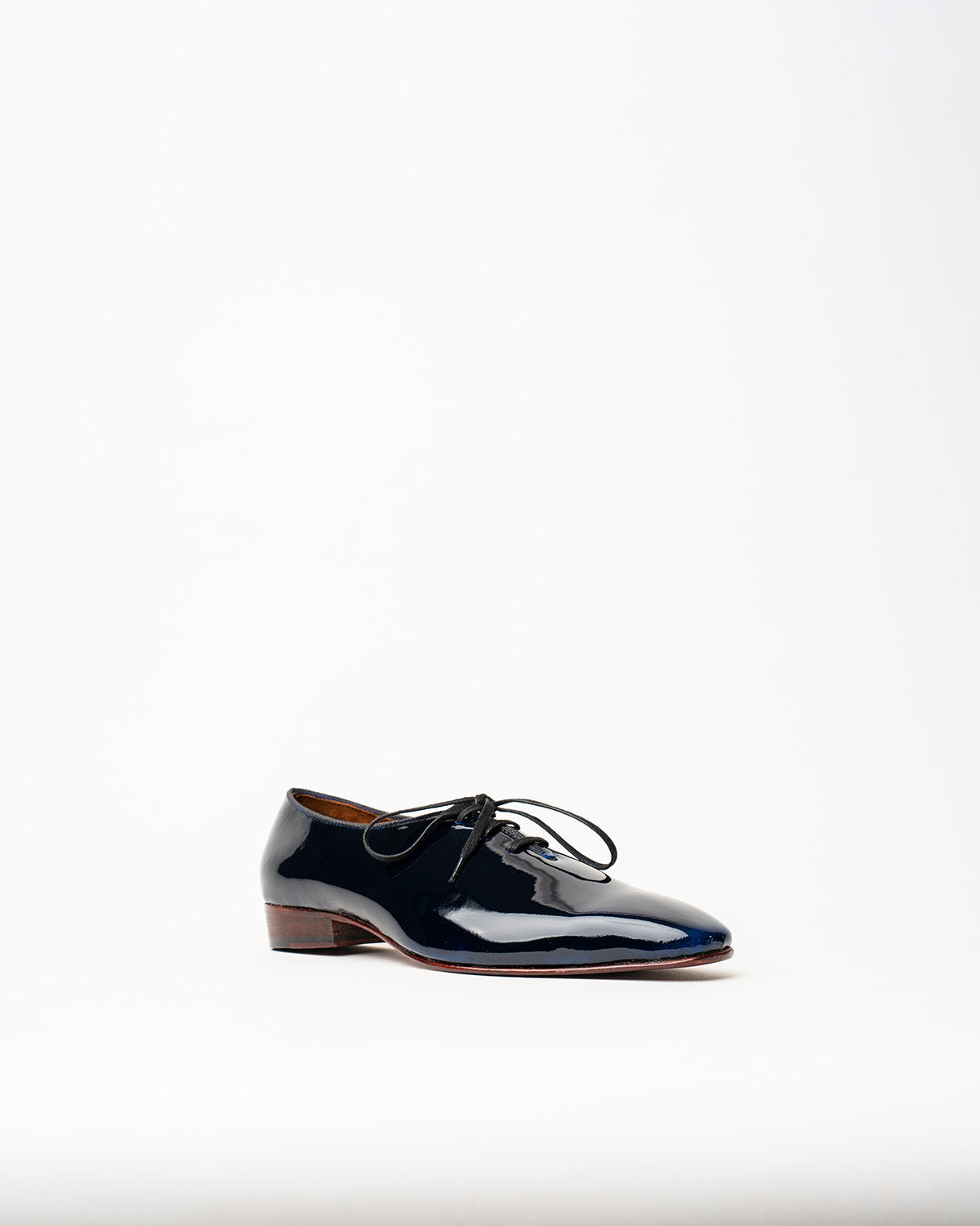 LACED WHOLECUT SHOES WITH A SQUARE POINTED TOE AND STACKED HEEL.